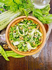 Image showing Salad with squash and sorrel on dark board top