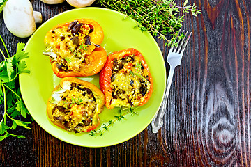 Image showing Pepper with mushrooms and couscous in green plate top