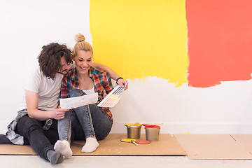 Image showing Happy young couple relaxing after painting