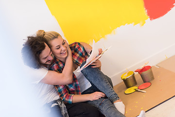 Image showing Happy young couple relaxing after painting