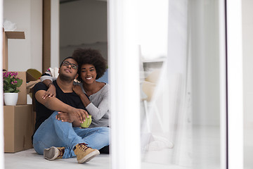 Image showing African American couple relaxing in new house