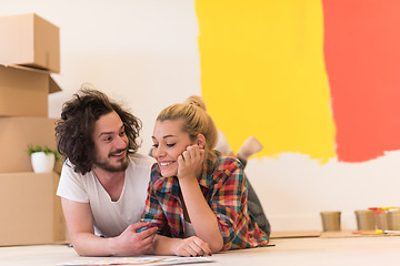 Image showing Happy young couple relaxing after painting