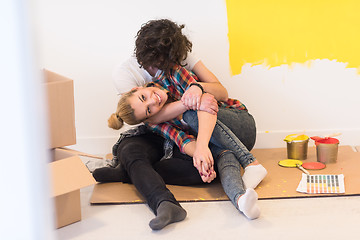 Image showing Happy young couple relaxing after painting