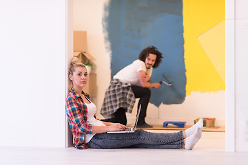 Image showing Happy couple doing home renovations