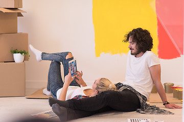 Image showing Happy young couple relaxing after painting