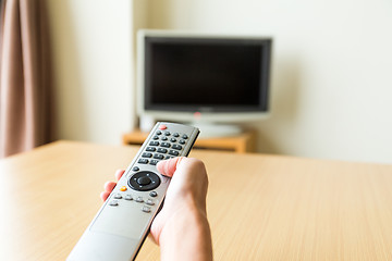 Image showing TV remote control in hand