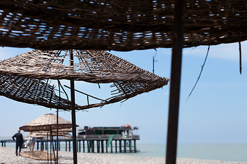 Image showing Old sunshade with hole on beach 