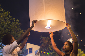 Image showing Couple release Chinese lantern