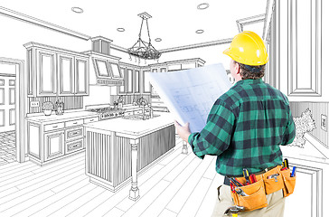 Image showing Male Contractor with Hard Hat and Plans Looking At Custom Kitche