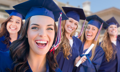 Image showing Happy Graduating Group of Girls In Cap and Gown Celebrating on C