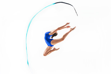 Image showing The portrait of beautiful woman gymnast on white