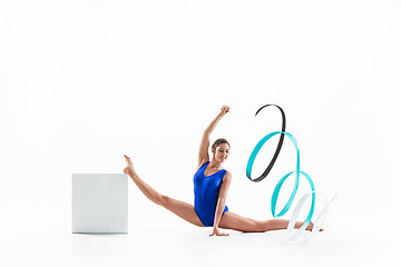 Image showing The portrait of beautiful woman gymnast on white