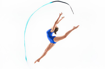 Image showing The portrait of beautiful woman gymnast on white