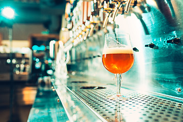 Image showing Beer taps in a pub