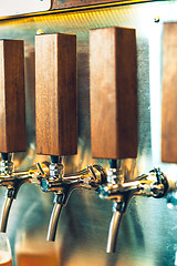 Image showing Beer taps in a pub