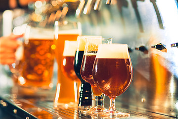 Image showing Beer taps in a pub