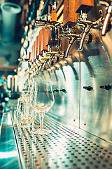 Image showing Beer taps in a pub