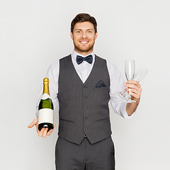 Image showing man with bottle of champagne and glasses at party