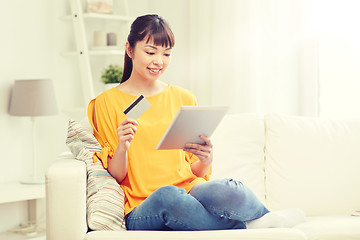 Image showing happy asian woman with tablet pc and credit card