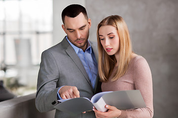 Image showing businesswoman and businessman with folder