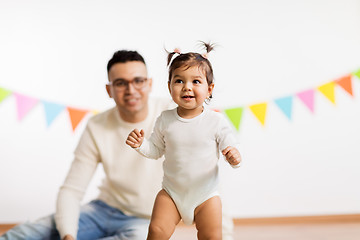 Image showing happy father and little daughter at birthday party