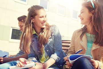 Image showing group of students with notebooks at school yard