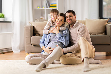 Image showing happy family with pregnant mother at home