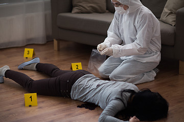 Image showing criminalist collecting crime scene evidence