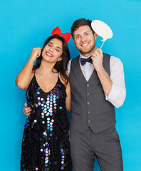 Image showing happy couple with party props having fun