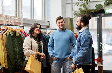 Image showing friends shopping bags at vintage clothing store