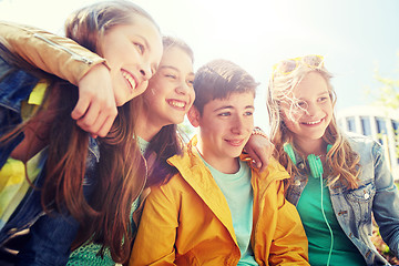 Image showing happy teenage students or friends outdoors