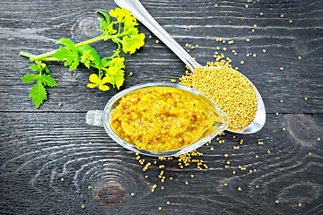 Image showing Sauce mustard Dijon in sauceboat with flower on board top