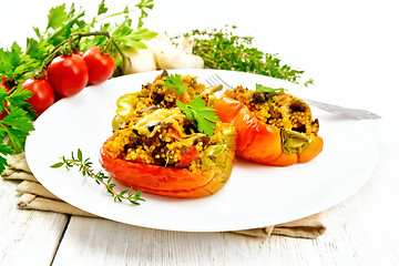 Image showing Pepper stuffed with mushrooms and couscous in plate on table
