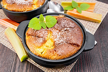 Image showing Klafuti with rhubarb and mint in brazier on dark board