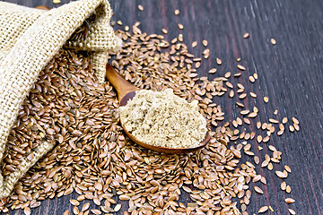 Image showing Flour flax in spoon with seeds on board