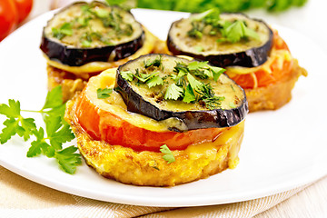 Image showing Appetizer of aubergines and cheese in plate on towel