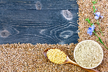 Image showing Flour and seeds flax on black board