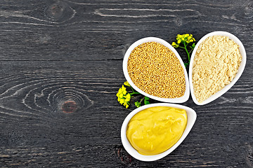 Image showing Mustard different in bowls with flower on board