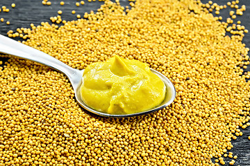 Image showing Sauce mustard in spoon on seeds