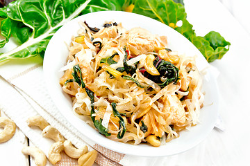 Image showing Funchoza with chard and meat in bowl on board