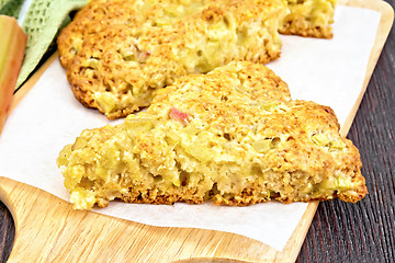 Image showing Scones with rhubarb on wooden table