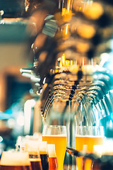 Image showing Beer taps in a pub