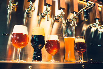 Image showing Beer taps in a pub