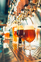 Image showing Beer taps in a pub