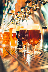 Image showing Beer taps in a pub