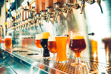 Image showing Beer taps in a pub