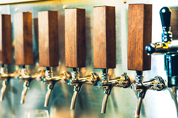 Image showing Beer taps in a pub