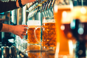 Image showing Beer taps in a pub