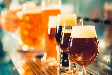 Image showing Beer taps in a pub