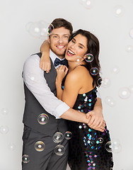 Image showing happy couple hugging in soap bubbles at party